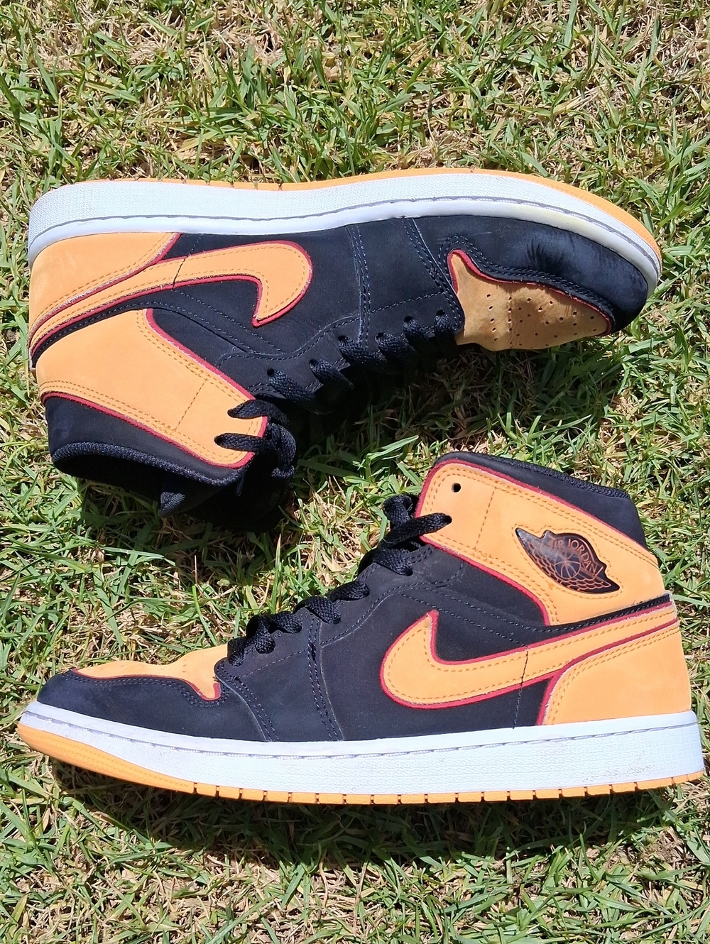 Jordan High-Top Sneakers in Black & Orange